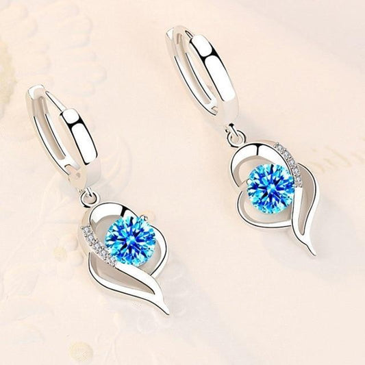 Orecchini a bottone floreali in argento con zirconia