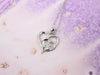 Collana d'argento con impronta di zampa e cuore in zirconi
