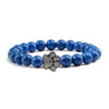 Bracciale con zampa decorato con perline di pietre naturali