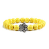 Bracciale con zampa decorato con perline di pietre naturali