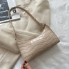 Tilly™ | Borsa a spalla lucida con motivo alligatore
