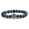 Bracciale con zampa decorato con perline di pietre naturali