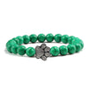 Bracciale con zampa decorato con perline di pietre naturali
