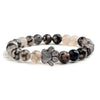 Bracciale con zampa decorato con perline di pietre naturali