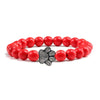 Bracciale con zampa decorato con perline di pietre naturali
