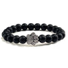 Bracciale con zampa decorato con perline di pietre naturali
