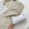 Tilly™ | Borsa a spalla lucida con motivo alligatore
