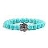 Bracciale con zampa decorato con perline di pietre naturali