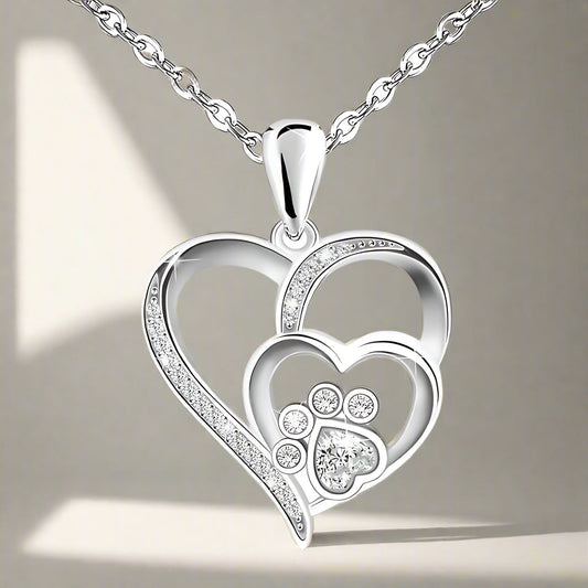 Collana d'argento con impronta di zampa e cuore in zirconi