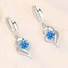 Orecchini a bottone floreali in argento con zirconia