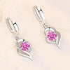 Orecchini a bottone floreali in argento con zirconia